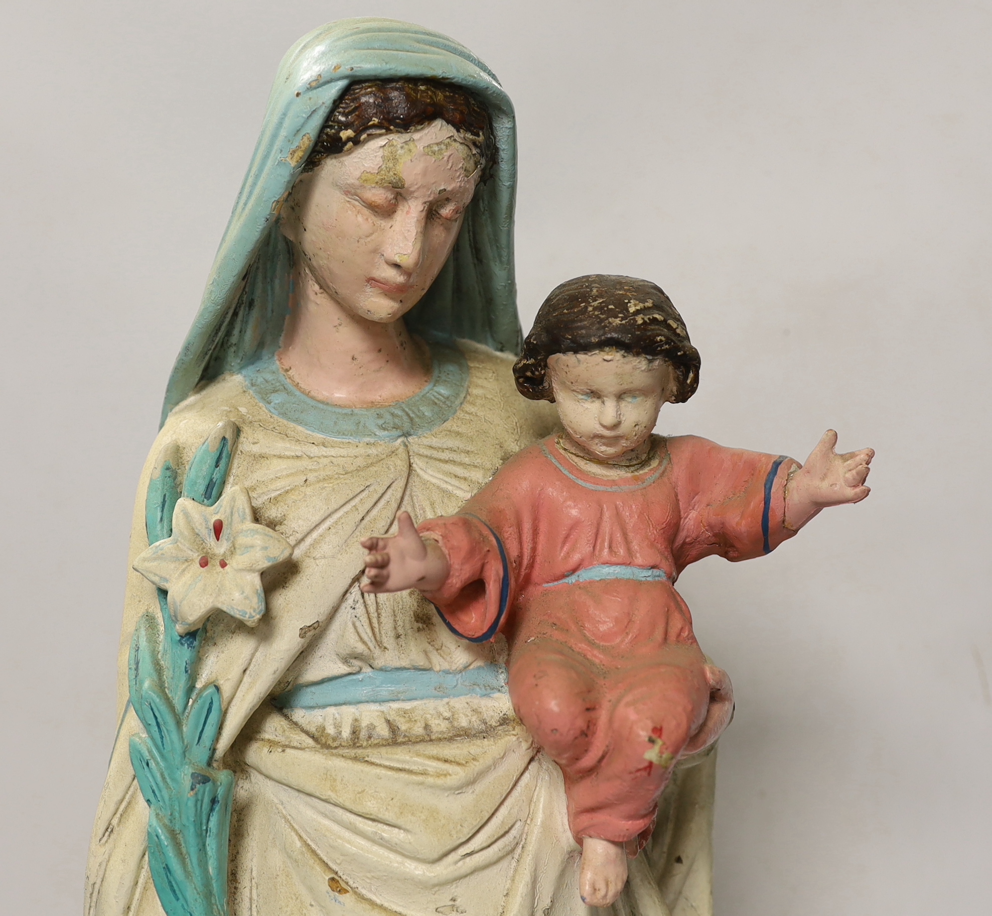 A painted plaster model of Madonna and child, 61cm high